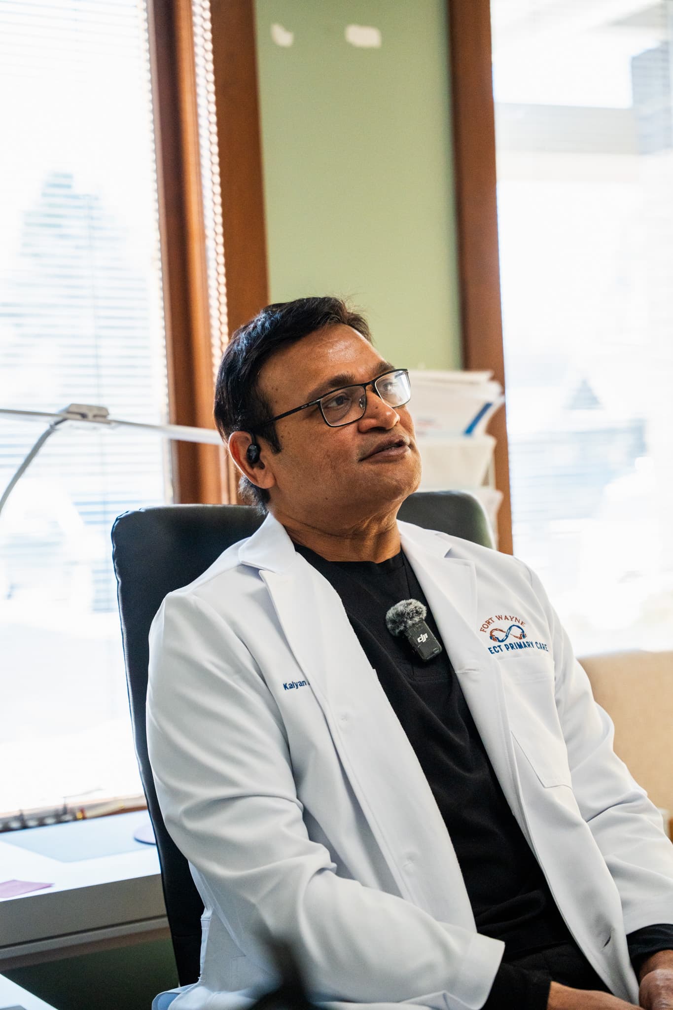 Dr. Aluri talking with a patient